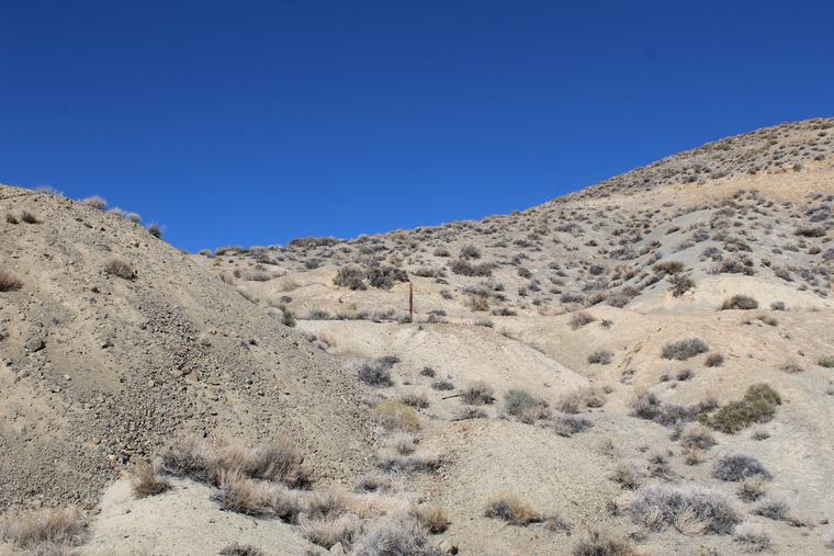 Waste-rock berm and vehicle track — WWII-era surface disturbance